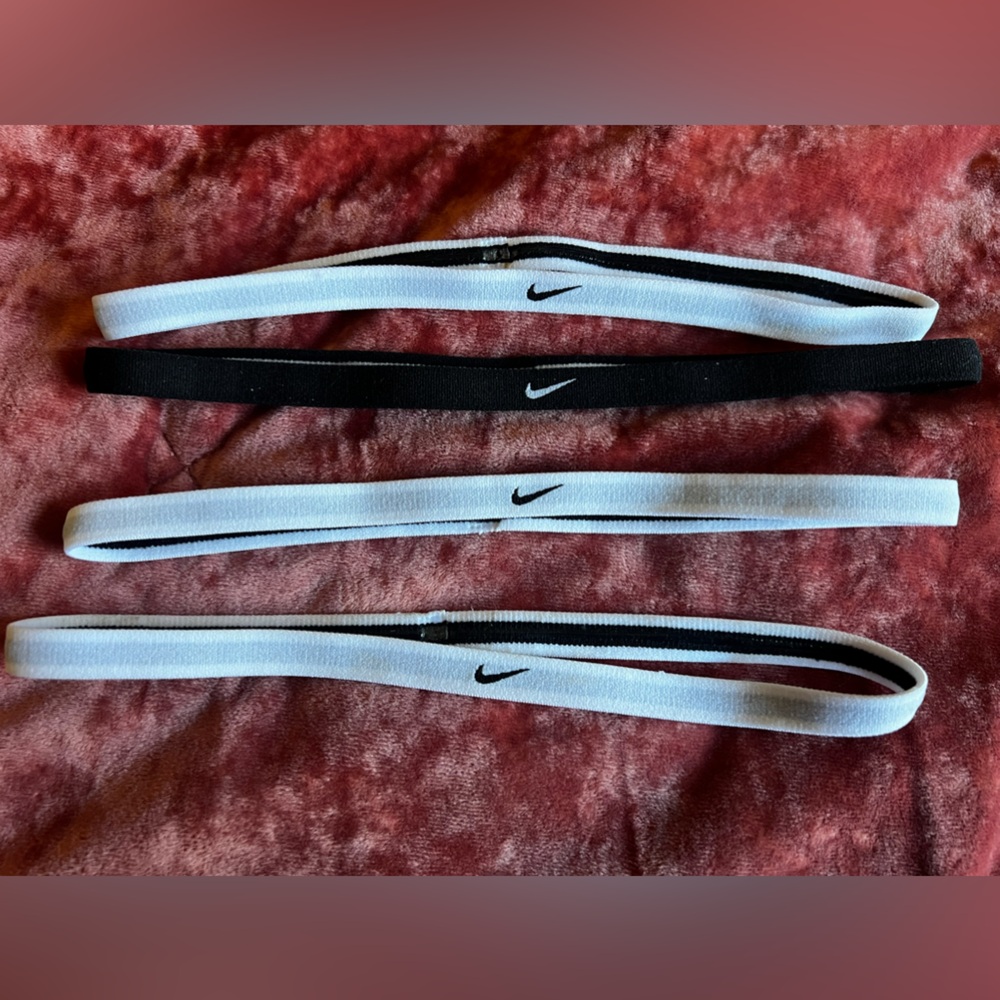 Five thin Nike headbands with grip